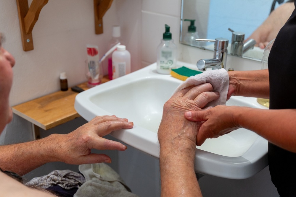 elderly,man,having,hand,washing,hygiene,care,at,home,with