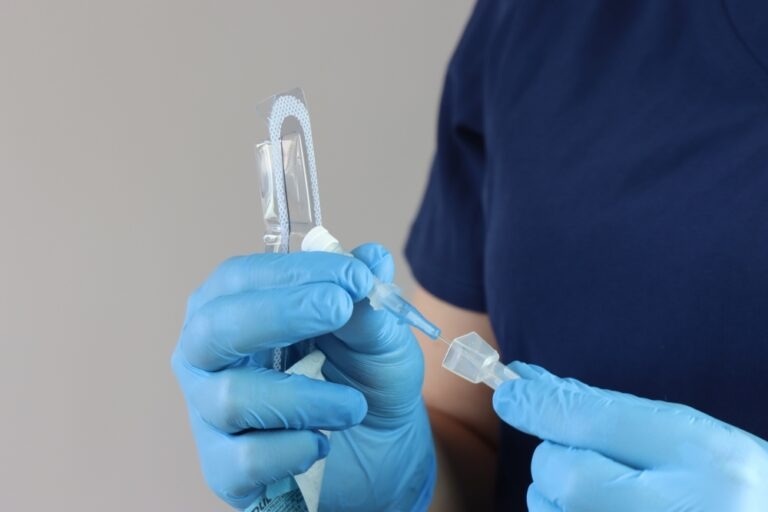 health,care,professional,wearing,gloves,manipulating,the,peripheral,catheter,pack